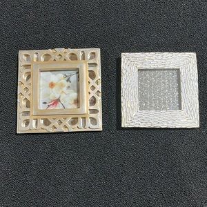2 Nicole Miller Home frames, gold tones, both hold 4”x 4” photos.
